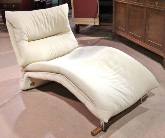 ITALIAN MODERN LEATHER CHAISE LOUNGE: Chrome metal and wood base. Light wear and soiling to leather. 38"h. x 35"w. x 58"d.