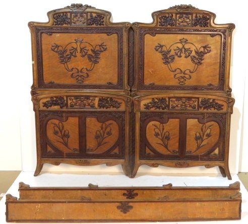FRENCH ART NOUVEAU CARVED HIGHBACK BED: One set of outside rails. Missing one small moulding. Good condition. 73 1/2"h. x 84"w. x 84 1/2"d.