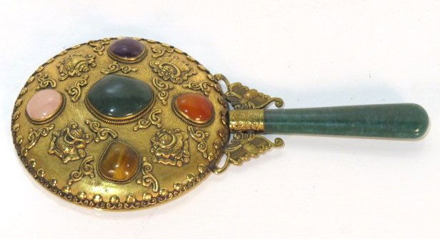ASIAN BRASS MIRROR w/ JADE HANDLE: Applied semi-precious stones. Very good condition. 8 1/4"h. x 4 1/2"w.