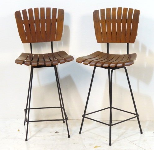 Pair UMANOFF STYLE SLATTED WOOD & IRON BAR STOOLS: Slatted wood seats and backs. Iron bases. Good condition. Light wear. 37 1/2"h. x 17 3/4"w. x 18"d.