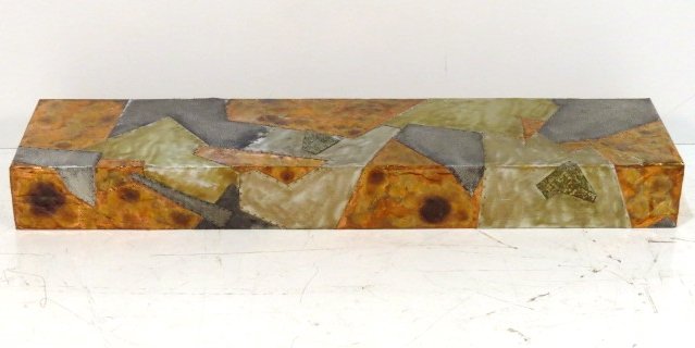 PAUL EVANS STYLE METAL PATCHWORK SHELF: Riveted sheet metal on wood. Very good condition. 6 1/4"h. x 60"w. x 15"d.