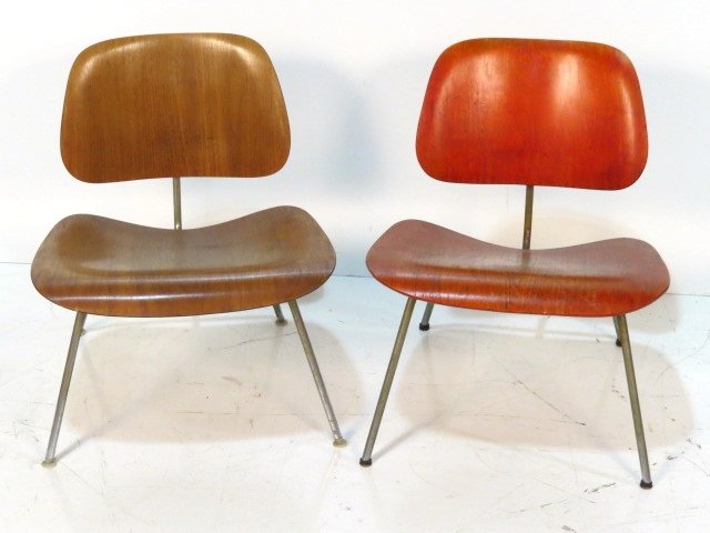 Pair CHARLES & RAY EAMES LCM BENTWOOD WALNUT CHAIRS: Molded plywood. Wear to finish. Pitting on metal. Fair condition. 27"h. x 22"w. x 23"d.