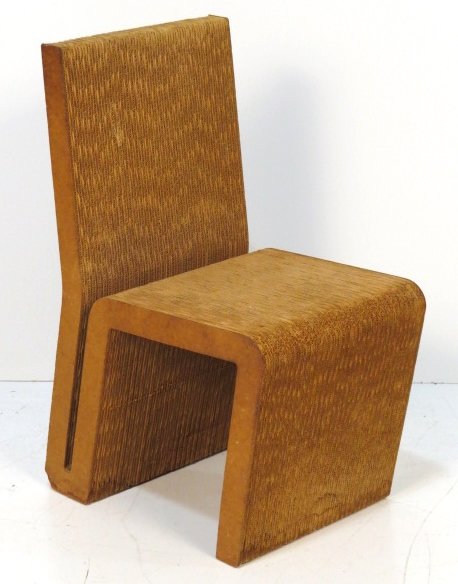 FRANK GEHRY EASY EDGES CORRUGATED CARDBOARD CHAIR: Corrugated cardboard and masonite. Some light crushing on edges. Good condition. 32 1/2"h. x 16 3/8"w. x 21 1/4"d.