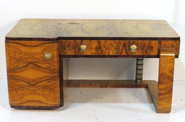 ART DECO CIRCASSIAN WALNUT EXECUTIVE DESK: Circassian walnut with metal column. Worn finish on top. Good condition. 31"h. x 66"w. x 35"d.