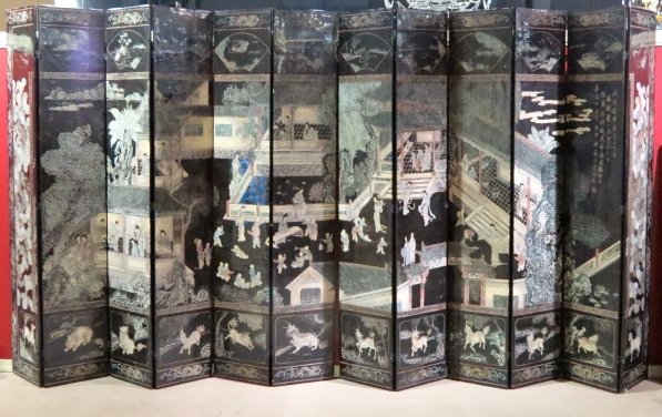 ANTIQUE CHINESE 12 SECTION COROMANDEL SCREEN: Black lacquer with carved figures. 104"h. x 228"w.