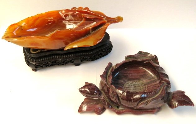2 CHINESE HARDSTONE CARVED BOWLS CARNELIAN: Chinese carved carnelian leaf form bowl and purple hardstone flower form bowl. Carnelian 1 7/8"h. x 8 3/4"w. x 4 1/4"d. Purple hardstone 1 5/8"h. x 7 1/2"w. x 4 3/4"d.