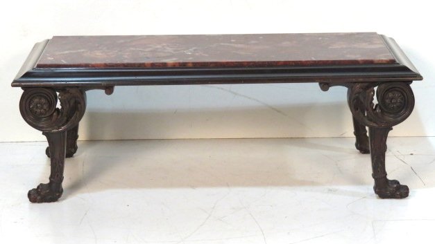 REGENCY STYLE CLAW FOOT MARBLETOP COFFEE TABLE: Rouge marble top. Mahogany with carved legs and claw feet. 18 1/2"h. x 52"w. x 22 1/2"d.