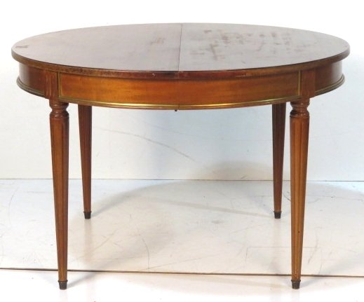 LOUIS XV STYLE ROUND MAHOGANY EXTENSION DINING TABLE: Mahogany with bronze mouldings. 29 1/2"h. x 45 1/4"diam.