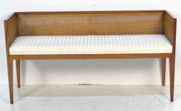 MID CENTURY MODERN CANED WINDOW SEAT: Walnut with caned panels. 28"h. x 53 1/2"w. x 17"d.