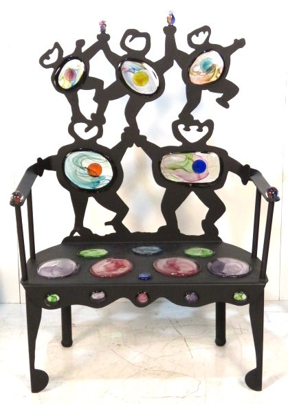 D & K SMITH MODERN IRON SETTEE with ART GLASS: Black iron with art glass inserts and finials. Signed D & K Smith 1997. 54 3/4"h. x 38"w. x 21"d.