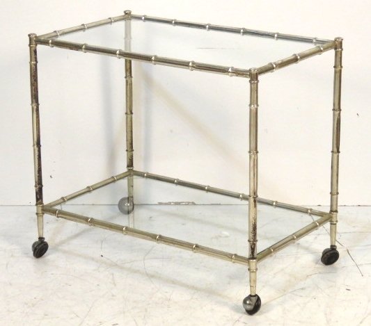 BAMBOO FORM CHROME & GLASS BAR CART: Chrome and metal frame with glass shelves. 26"h. x 19 1/4"w. x 17 1/4"d.