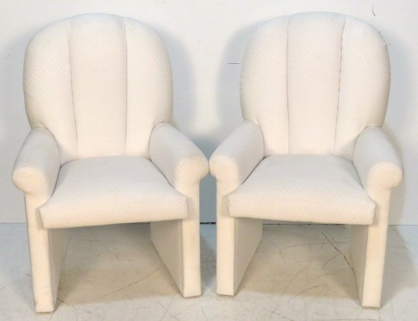 MILO BAUGHMAN WHITE UPHOLSTERED ARMCHAIRS: White upholstered chairs. 39 1/4"h. x 27 1/2"w. x 25 1/2"d.