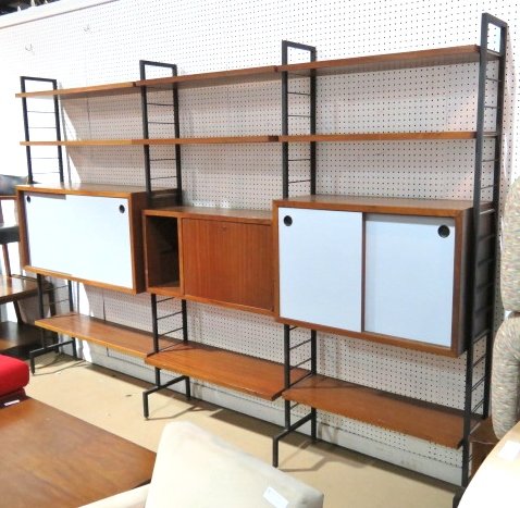 ITALIAN MODERN IRON & TEAK WALL UNIT: Iron supports with teak cabinets and shelves. 78 1/4"h. x 118"w. x 14"d.