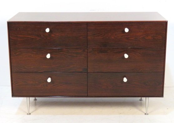 GEORGE NELSON HERMAN MILLER ROSEWOOD CHEST: Rosewood with porcelain handles and metal legs. 31"h. x 46"w. x 18 1/2"d.