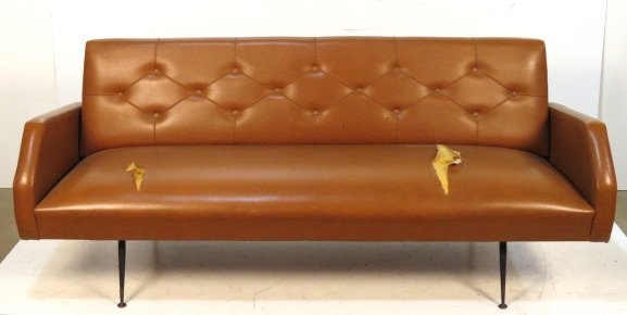 ITALIAN MODERN IRON & NAUGAHYDE DAYBED: Naugahyde with iron frame. 31 1/2"h. x 76"w. x 29 1/4"d.