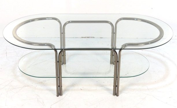 ITALIAN MODERN GLASS & CHROME COFFEE TABLE: Tubular chrome frame with beveled glass top. 16"h. x 47"w. x 23 1/4"d.