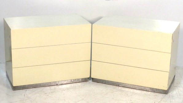 Pair MILO BAUGHMAN THAYER COGGIN 3 DRAWER CHESTS: White lacquer with chrome base. 25"h. x 31 1/4"w. x 18"d.