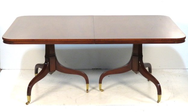 KITTINGER 9 FOOT BANDED MAHOGANY DINING TABLE: Mahogany with satinwood banding. Extends to 106" with two 18" boards. 29 1/4"h. x 44"w. x 70"d.