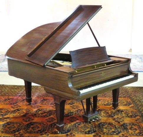 STEINWAY MAHOGANY BABY GRAND PIANO: Serial no. 61116. Mahogany case. 39 1/2"h. x 73 1/2"d. x 58"w.