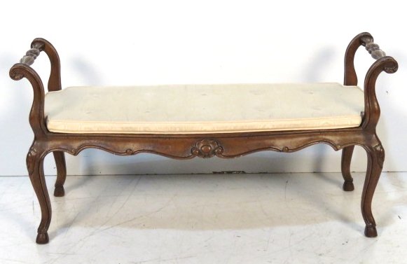 FRENCH CARVED WALNUT WINDOW BENCH: Caned seat. 22"h. x 41 1/2"w. x 19"d.