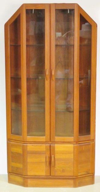 ULDUM DANISH MODERN TEAK CORNER CABINET: Teak cabinet with glass shelves. 78 1/2"h. x 40"w. x 18 1/2"d.