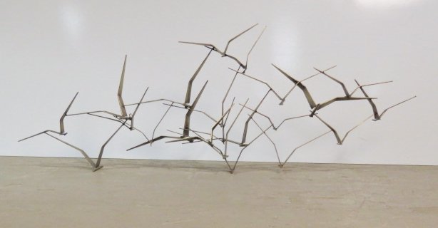 CURTIS JERE 59" BRASS BIRD SCULPTURE: Signed C. Jere, 71'. 21 1/2"h. x 59"w. x 8"d.