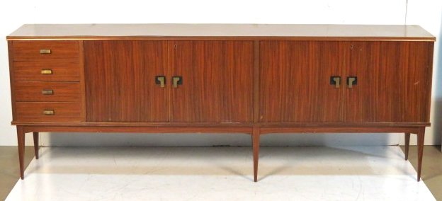 ITALIAN MODERN TEAK SIDEBOARD: Teak with formica top. 25 1/4"h. x 97 3/4"w. x 17 1/4"d.