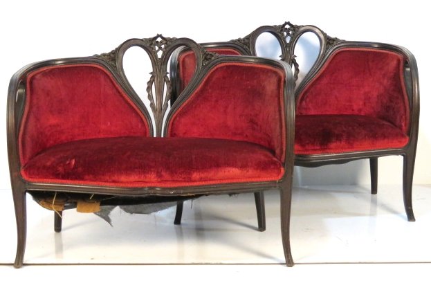 Pair ART NOUVEAU MAHOGANY CARVED LOVESEATS: Finely carved frames. 33"h. x 41 3/4"w. x 22"d.