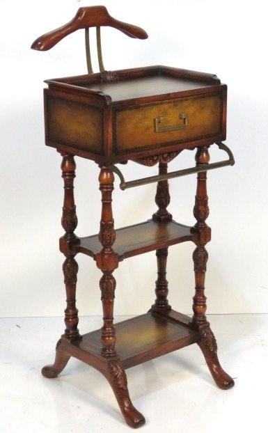 JOHN RICHARD ENGLISH STYLE LEATHERTOP VALET STAND: Leather top and leather drawer front. Distressed finish. 49"h. x 19"w. x 21"d.