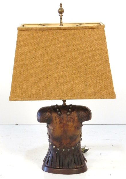 ITALIAN LEATHER BREASTPLATE FORM TABLE LAMP: Italian leather base with burlap shade. 29 1/4"h.