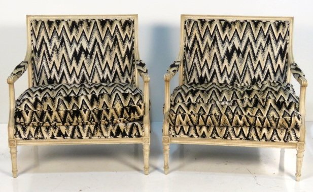 Pair LOUIS XVI STYLE CREAM PAINTED WIDE BERGERES: Distressed cream paint. 34"h. x 32 1/2"w. x 24 1/2"d.