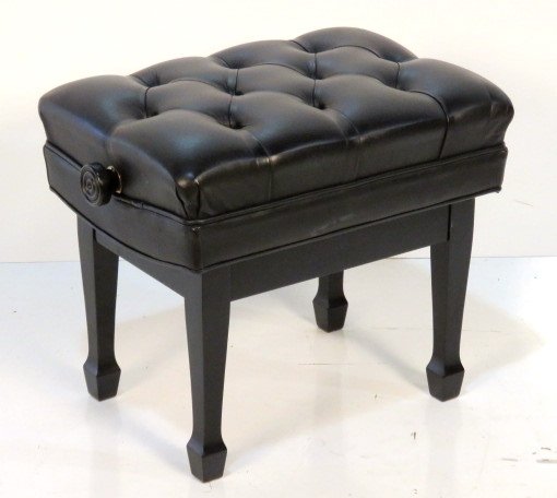 PAUL JANSEN MECHANICAL PIANO STOOL: Scissor mechanism. Ebonized with tufted black leather. 20"h. x 25"w. x 17 1/4"d.