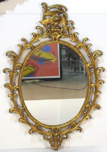 GEORGIAN STYLE OVAL GILT MIRROR w/ EAGLE: Oval gilt mirror with eagle. 51"h. x 39"w.