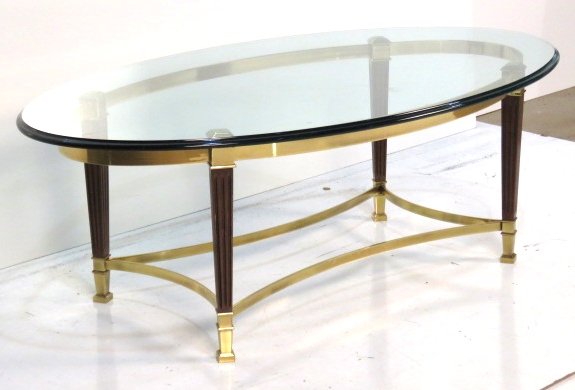 LOUIS XVI STYLE BRASS & GLASS COFFEE TABLE: Brass with wood columns. 17 1/4"h. x 50"w. x 28 1/4"d.