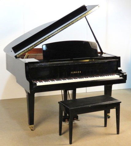 YAMAHA EBONIZED BABY GRAND PIANO MODEL GH1: Ebonized case. Serial number B4643931. 39 3/4"h. x 58 1/2"w. x 63"d.