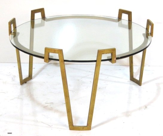 MODERN DESIGN GILT METAL GLASSTOP TABLE: Gold gilt metal. 20"h. x 37"diam.