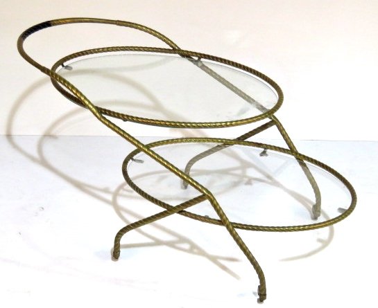 ITALIAN MODERN BRASS & GLASS OVAL BAR CART: Rope form brass with glass shelves. 20 3/4"h. x 18 1/4"w. x 37 3/4"d.