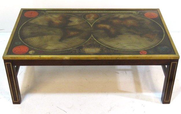 ENGLISH STYLE EGLOMISE TOP WORLD MAP COFFEE TABLE: Brass inlay and mouldings. Eglomise glass top with reverse image of world map. 15"h. x 40 1/4"w. x 24"d.