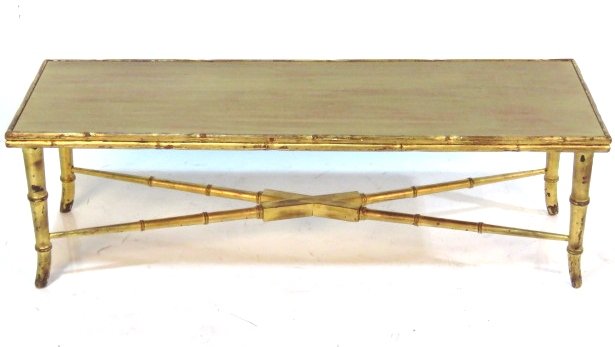 GOLD GILT FAUX BAMBOO COFFEE TABLE: Distressed gilt wood. 17"h. x 54"w. x 18"d.