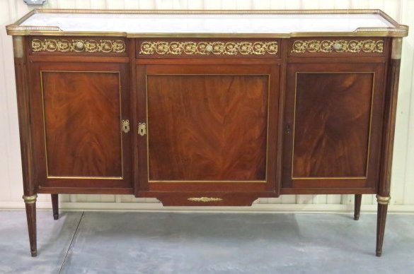 LOUIS XVI STYLE BRONZE MOUNTED MARBLETOP SIDEBOARD: Mahogany with bronze mounts and mouldings. 41"h. x 64 1/4"w. x 19"d.