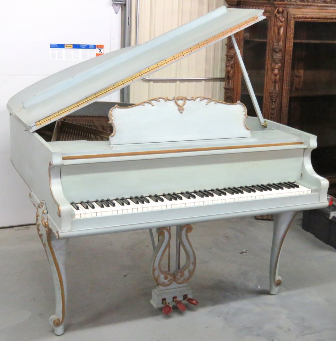 PAINT DECORATED CARVED BABY GRAND PIANO: Kranich & Bach. Light blue with gold paint decoration. 39 1/4"h. x 57 3/4"w. x 60 1/2"d.