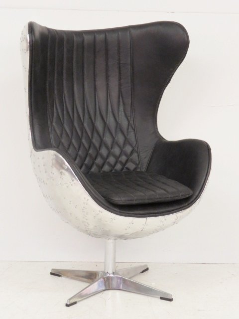 ARNE JACOBSEN STYLE INDUSTRIAL EGG CHAIR: Black leather upholstery. Patchwork chrome back. 47 1/2"h. x 32 1/4"w. x 29"d.