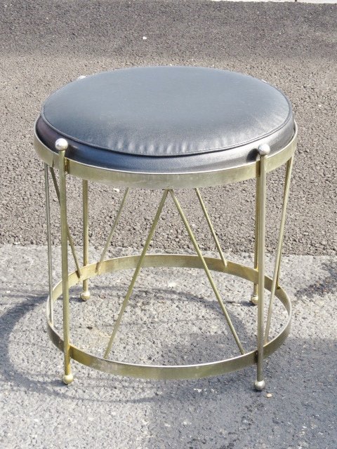 METAL FORM DRUM STOOL: Metal drum form base with black naugahyde. 17"h. x 17"diam.