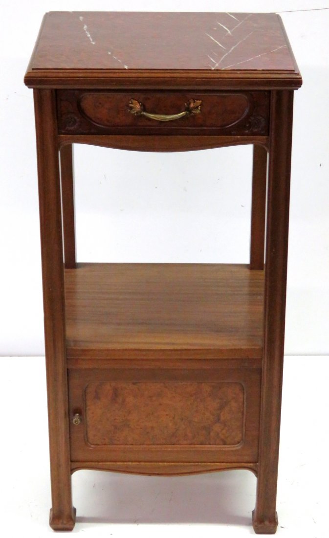 FRENCH ART NOUVEAU MARBLETOP NIGHTSTAND: Mahogany with burl walnut door. Black marble top. 33 3/4''h x 16 3/4''w x 14 3/4''d.