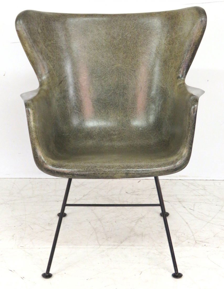 LUTHER CONOVER MOLDED FIBERGLASS ARMCHAIR: Bassick Nomar. Green fiberglass. Iron legs, foot caps marked. 33''h. x 26 1/2''w. x 27''d.