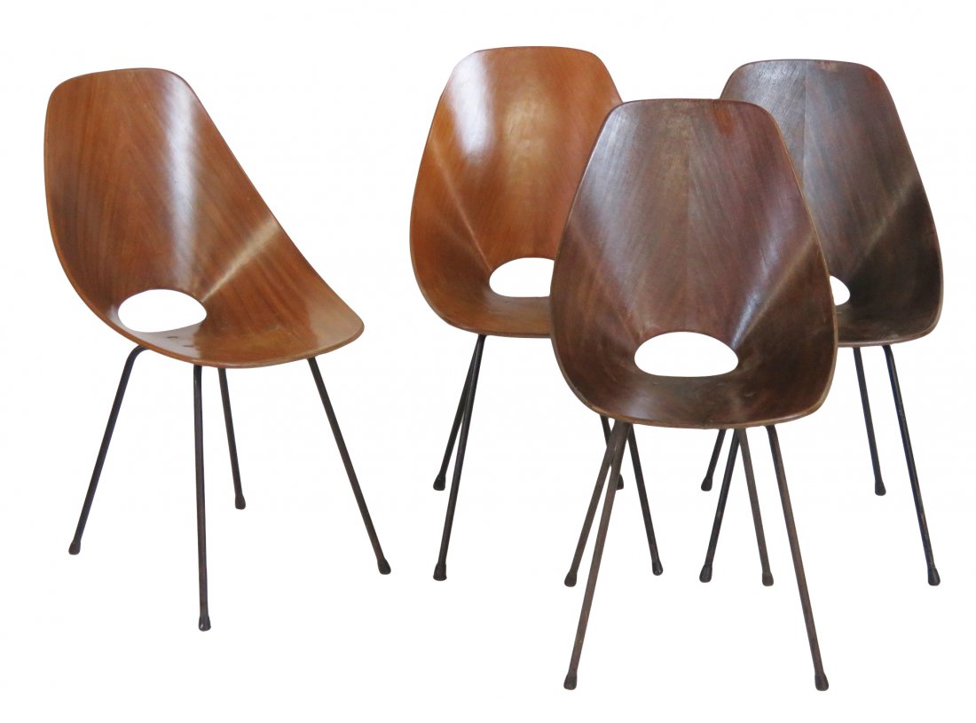 4 MEDEA MOLDED PLYWOOD SIDE CHAIRS: Molded teak plywood with iron legs. 32 1/2"h. x 17 3/4"w. 20 1/2"d.