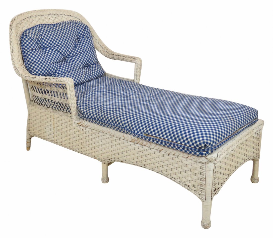 WHITE WICKER CHAISE LOUNGE: White wicker frame. 37"h. x 33"w. x 58"d.