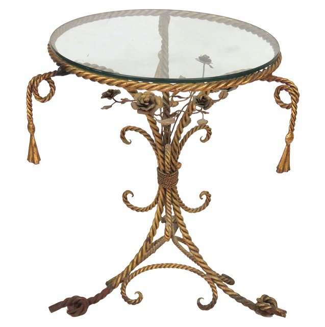 ITALIAN GILT IRON & ROPE TASSEL CENTER TABLE: Gilt wrought iron with flowers. Glass top. 31"h. x 28 1/2"diam.