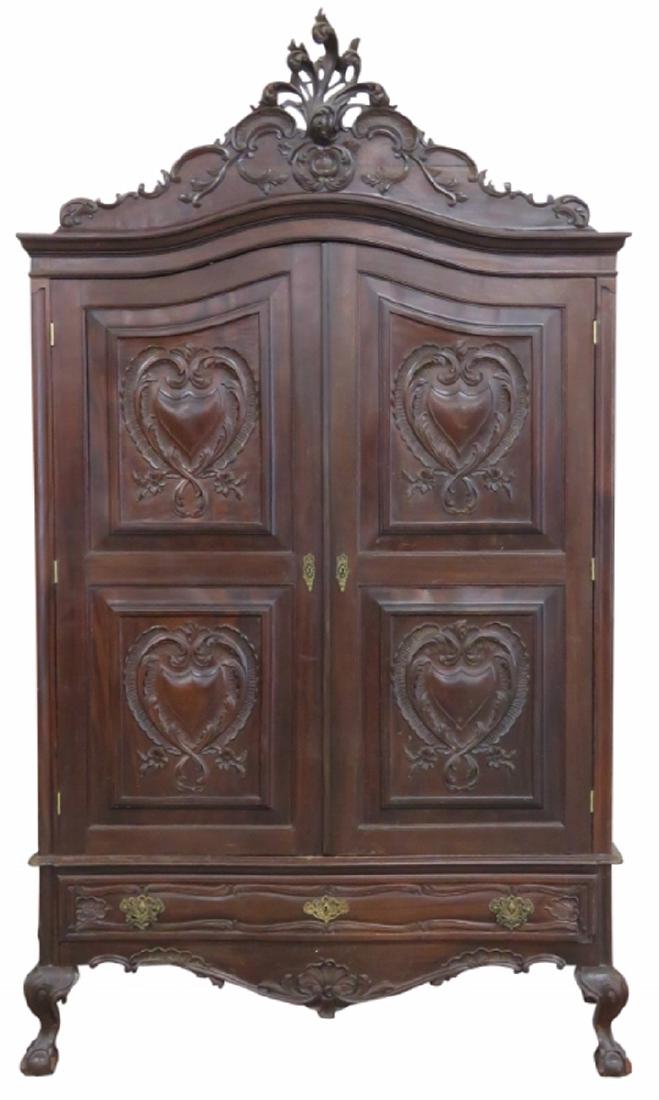 PORTUGESE CARVED 2 DOOR ARMOIRE: Carved frame with ball and claw feet. Brass hardware. 97 1/2"h. x 58 3/4"w. x 27"d.
