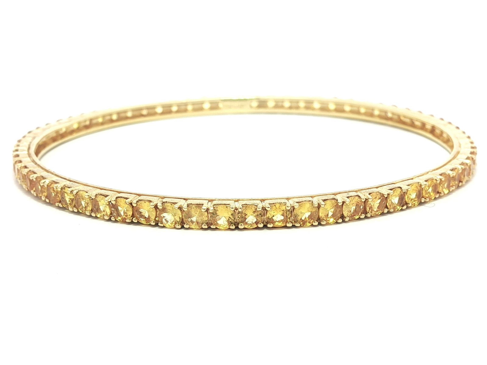 18k Gold Yellow Sapphire Eternity Tennis Slip On Bangle: 18k Yellow Gold Vivid Yellow Sapphire Eternity Tennis Slip On Bangle Bracelet --Stone(s):--Numerous Natural Genuine Sapphires - Round Brilliant Cut - Prong Set - Vivid Yellow Color - Natural Variation
